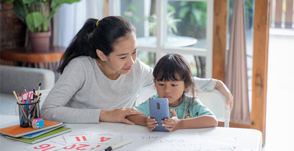 Mother and daughter looking at phone