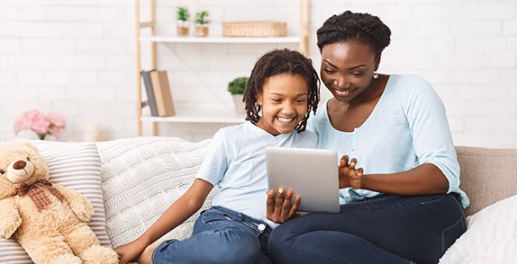 Mother and child looking at tablet