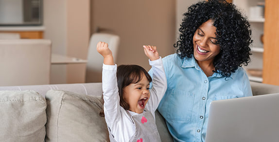 Mother and daughter with laptop