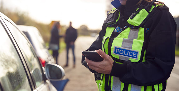 Police officer on his phone