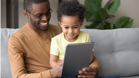Parent and child using tablet
