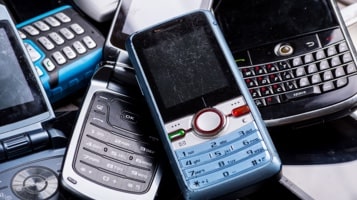 Old phones in a pile