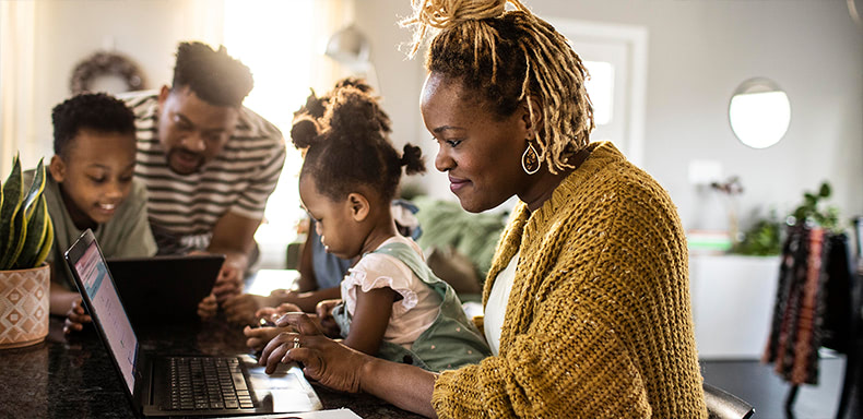 Black family at laptop
