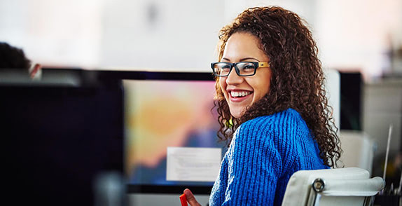 Woman smiling looking over her shoulder