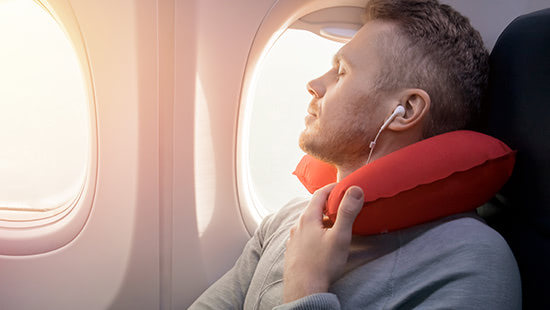 person on a plane wearing headphones