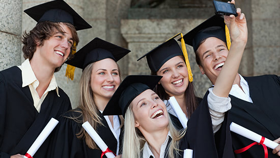 graduating students taking a group picture