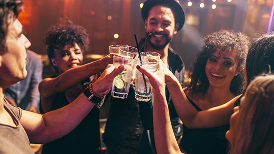 group of people clinking glasses