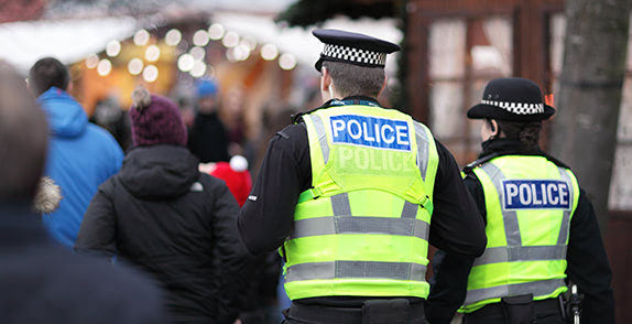 Two police officers working on the frontline