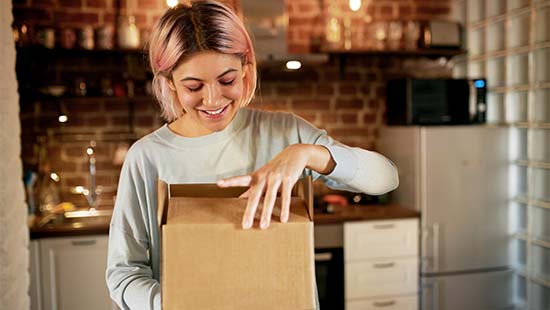 Woman opening a box