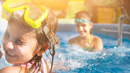kids wearing goggles in a pool