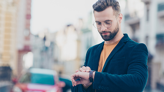 person looking at smartwatch on their wrist