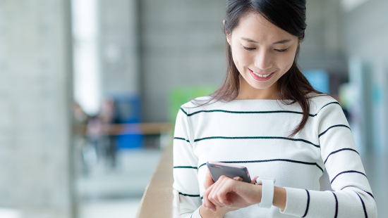 person looking at smartwatch on their wrist