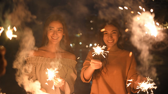 person holding sparklers