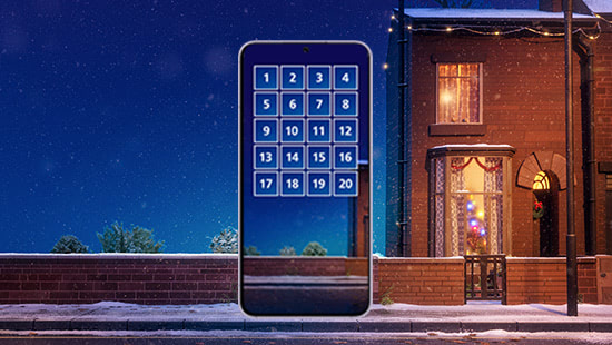 phone with advent calendar on it outside house