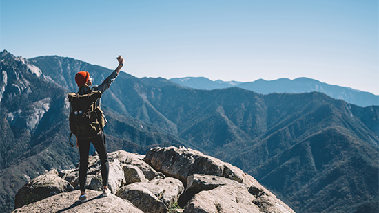 person standing on a mountain