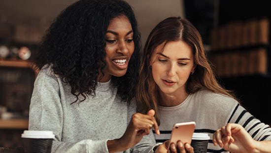 people looking at a phone