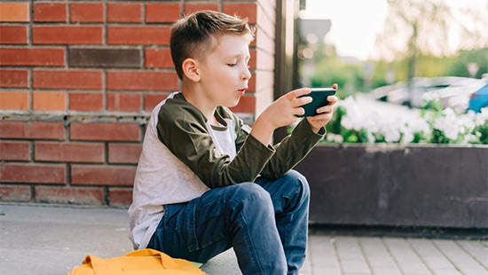 child holding a phone