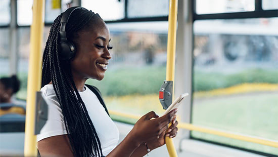 person on a bus holding a phone