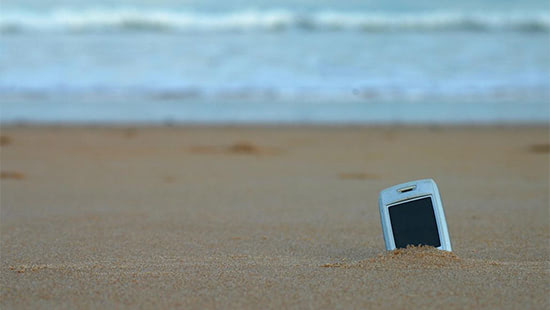 phone in the sand on a beach