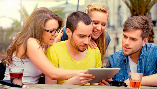 people looking at a tablet