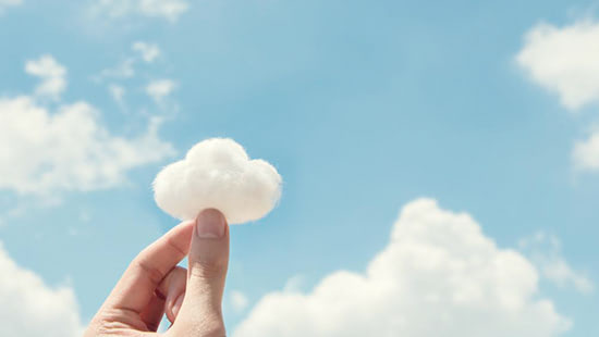 fingers holding a cloud