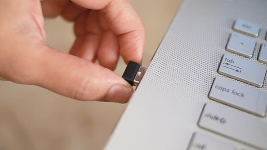 Inserting dongle into laptop